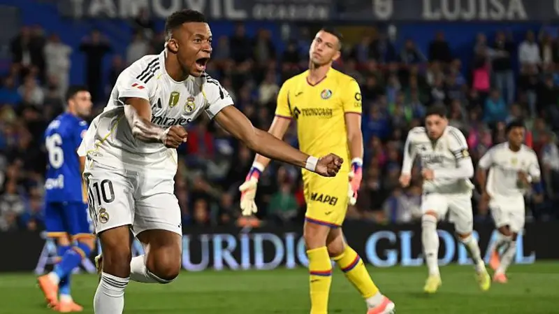 Berbekal satu gol tunggal Kylian Mbappe, Real Madrid meraih kemenangan tipis atas Getafe yang harus bermain dengan sembilan pemain.